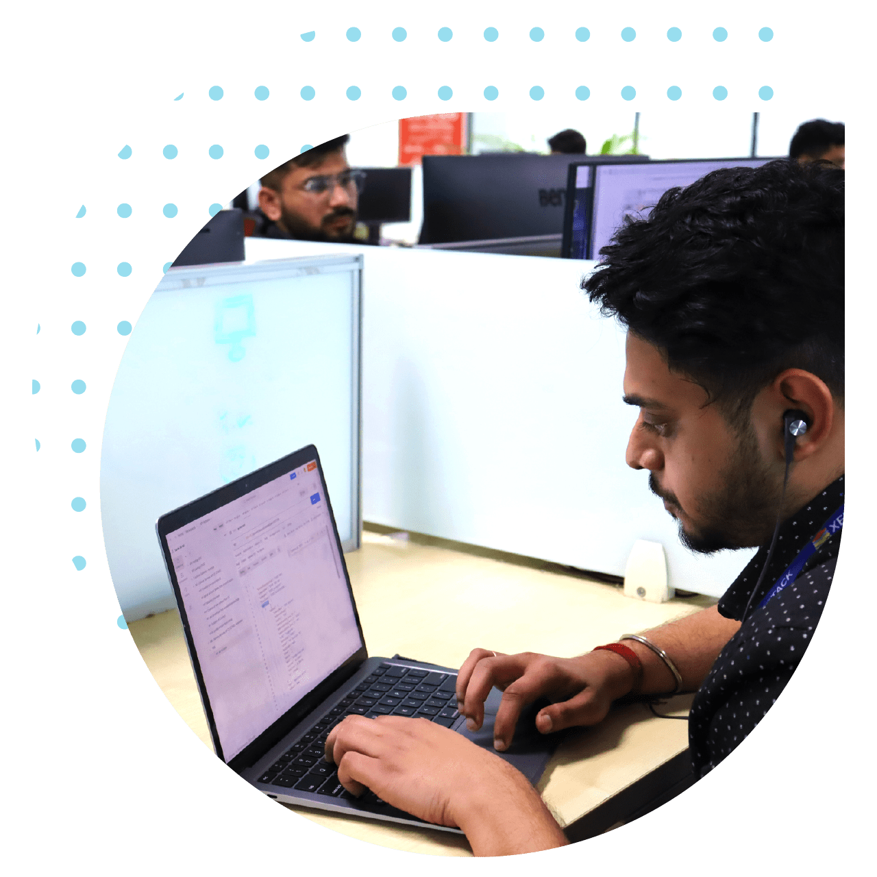 Individuals collaborating on laptops, emphasizing the enhancement of software deployment efficiency through expert consulting insights.